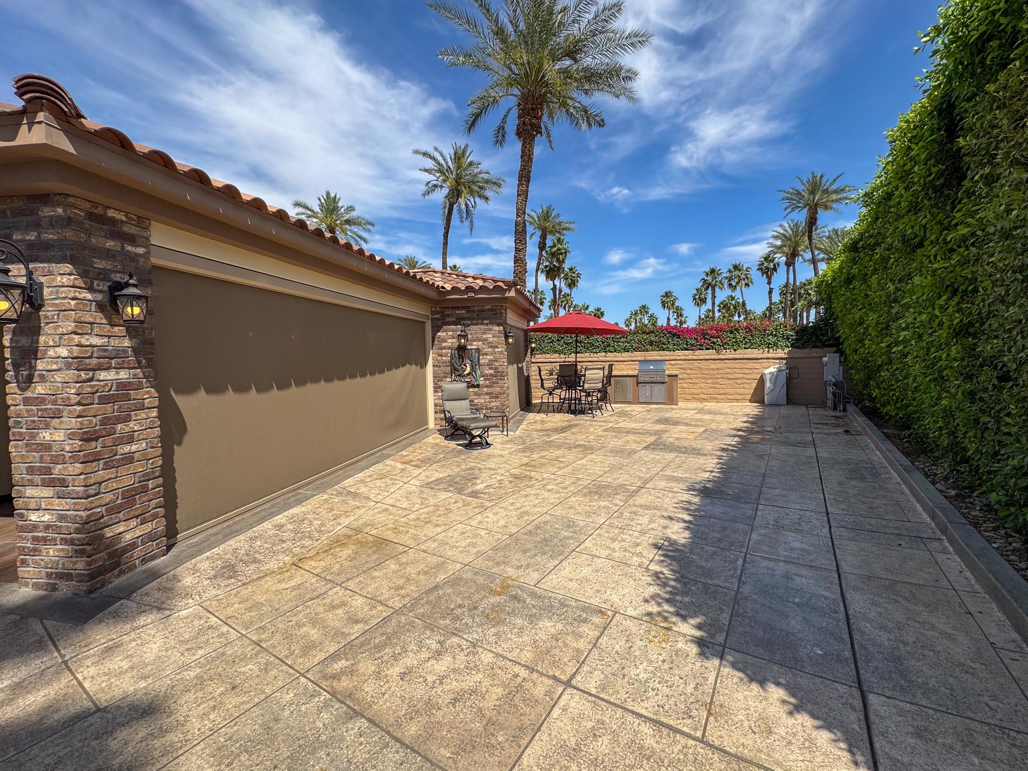 80394 Ave 48, Unit 116 Indio, CA 92201 - Photo 3 of 26 a view of a terrace with sky view