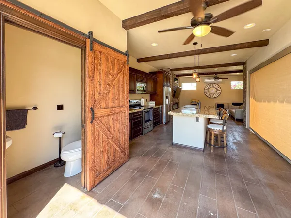 a living room with a furniture and a chandelier