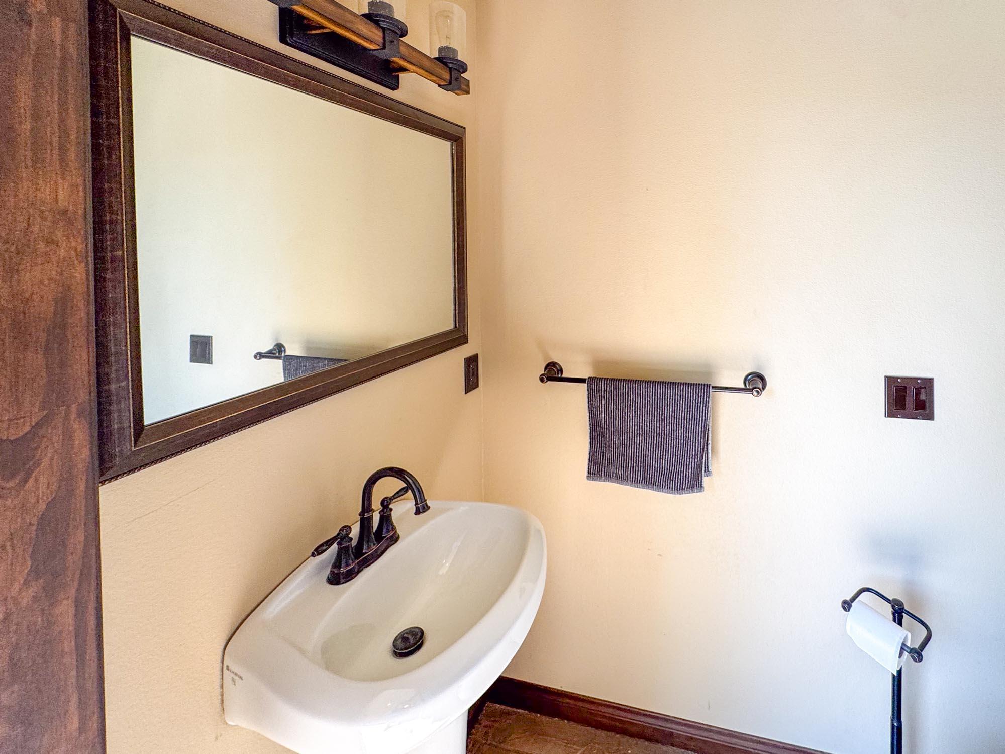 80394 Ave 48, Unit 116 Indio, CA 92201 - Photo 5 of 26 a bathroom with a sink and mirror