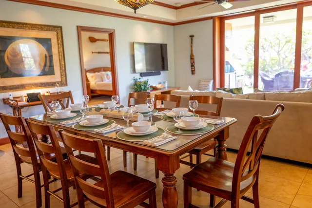 a dining room with furniture and window