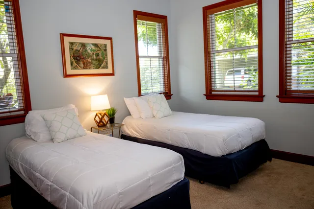 a bedroom with bed and window