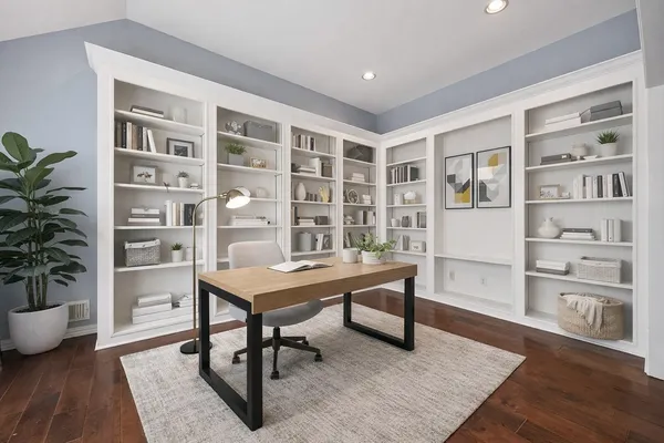 a view of a livingroom with furniture and a potted plant