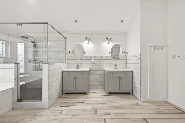 a bathroom with a sink vanity and a mirror