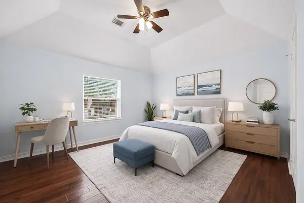 a bedroom with a bed and a table