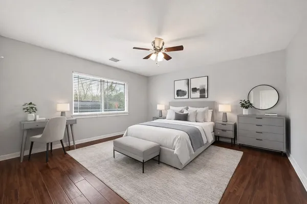 a bed room with a bed and a table