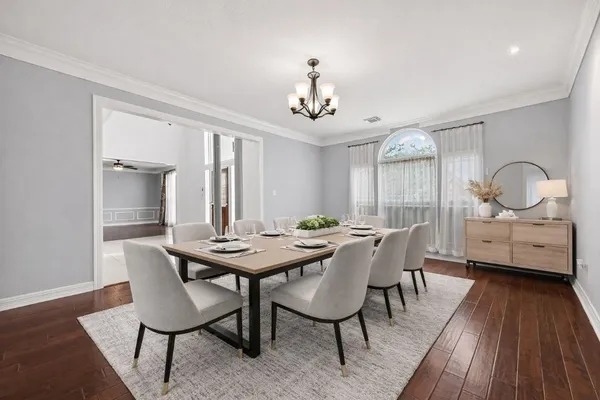 a view of a dining room with furniture window and wooden floor