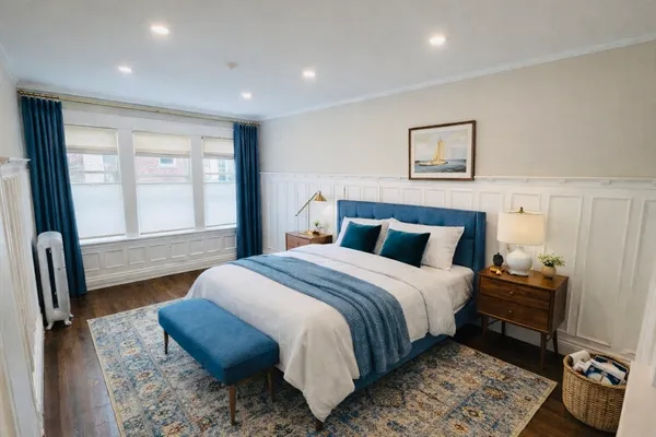 a bedroom with a bed and wooden floor