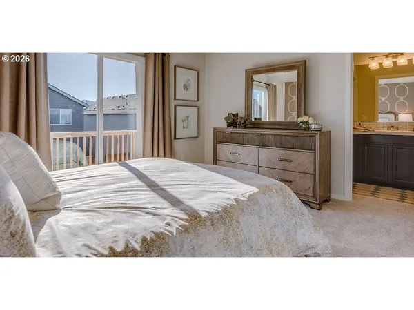 a bedroom with a bed and a dresser