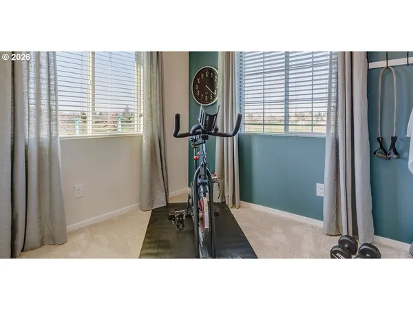 a picture of a room with a door and windows