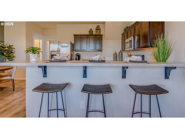 a bathroom with a sink a mirror and a lamp