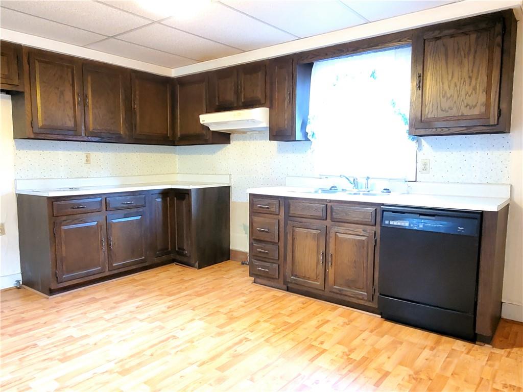 422 Thompson Run Road Pittsburgh, PA 15237 - Photo 4 of 10 a kitchen with stainless steel appliances granite countertop a sink and cabinets