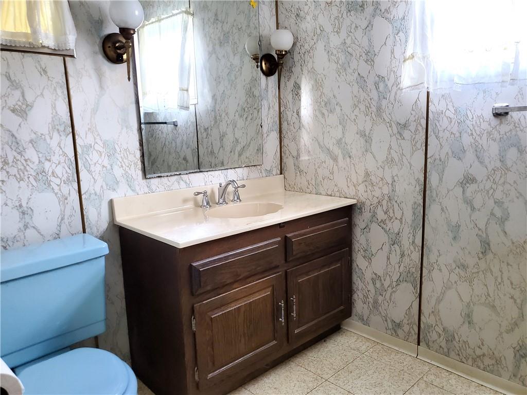 422 Thompson Run Road Pittsburgh, PA 15237 - Photo 6 of 10 a bathroom with a sink vanity and toilet