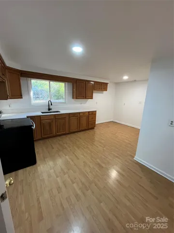 a view of kitchen and sink