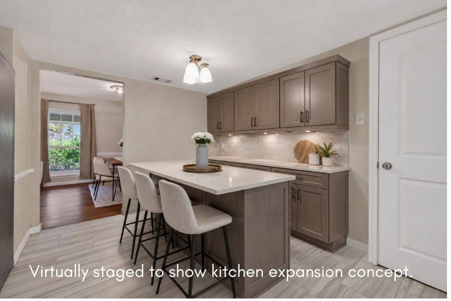 11600 Buckingham Road Austin, TX 78759 - Photo 16 of 37 A refined kitchen island with ample seating complements the stylish cabinetry and under-cabinet lighting.