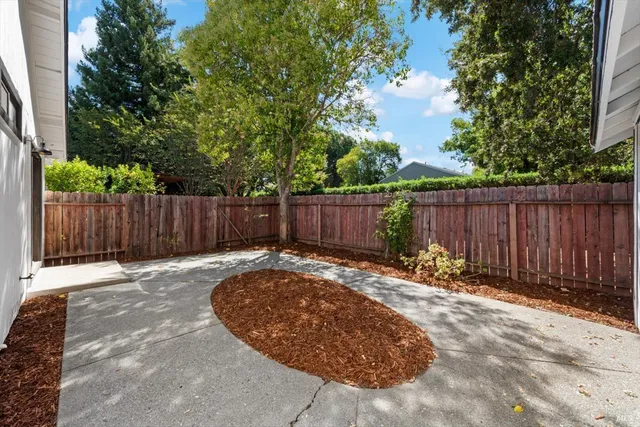 a view of outdoor space with wooden fence