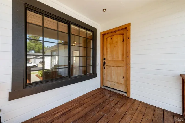a view of front door with wooden floor