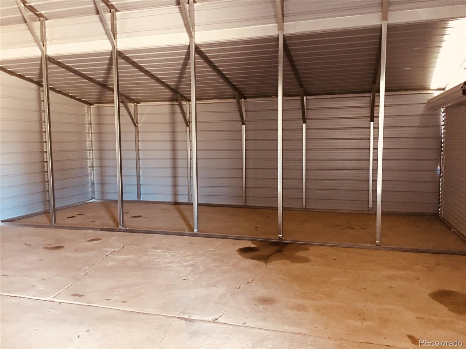211 Stegosaurus Freeway Dinosaur, CO 81610 - Photo 5 of 12 a view of an empty room with wooden walls