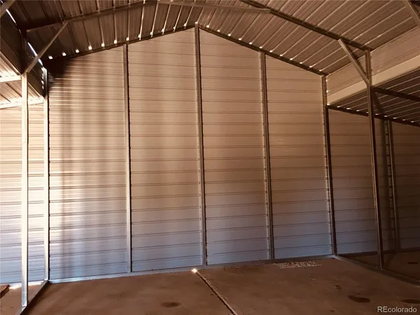 a view of a door and an empty room