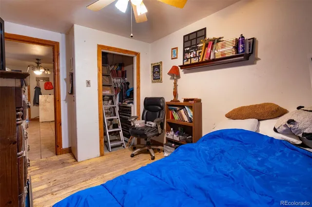 a bedroom with furniture and a chair