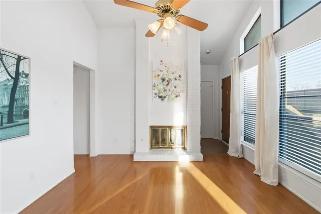 a view of livingroom with hardwood floor and a ceiling fan