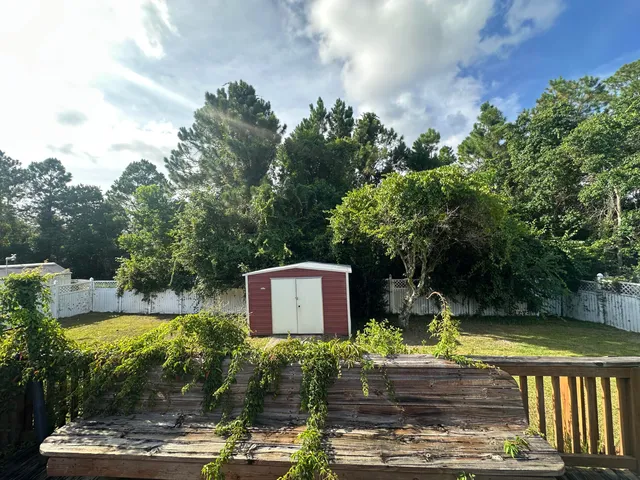 an empty room with a empty space and windows