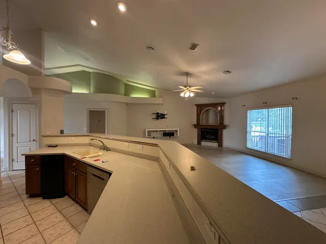 an empty room with a empty space and windows