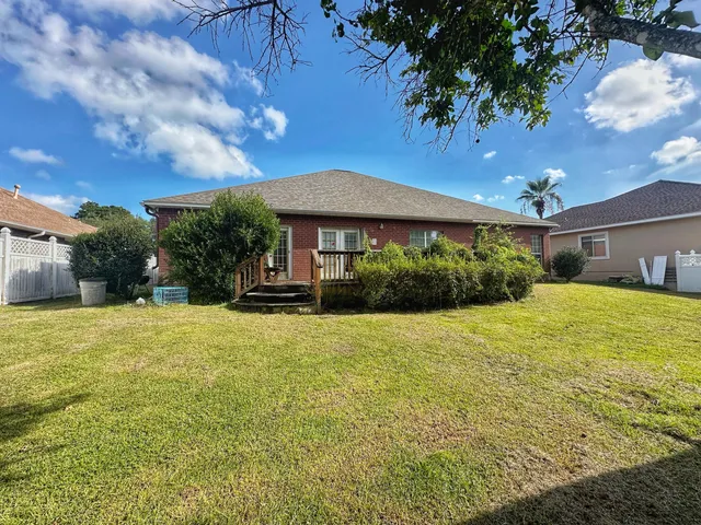 a bathroom with a granite countertop toilet and a shower