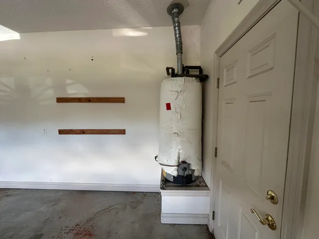 a large kitchen with stainless steel appliances lots of counter space and a sink