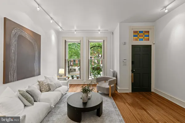 a living room with furniture and a large window