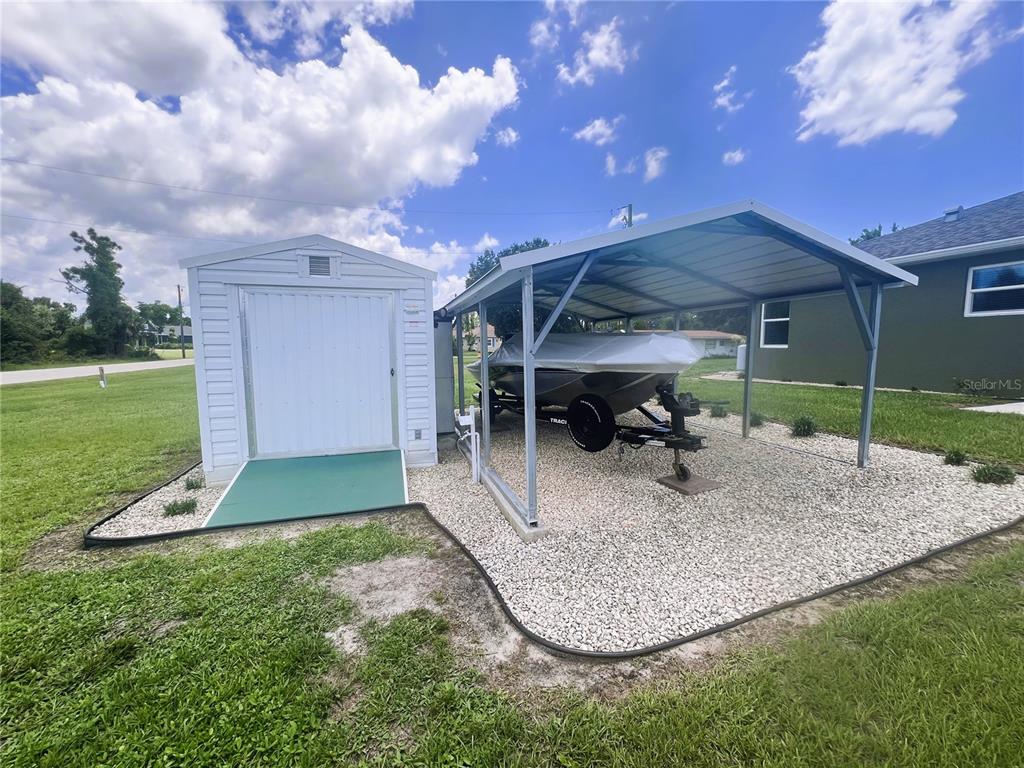 26513 Glaspell Road Punta Gorda, FL 33955 - Photo 22 of 31 Storage Shed with Boat Carport