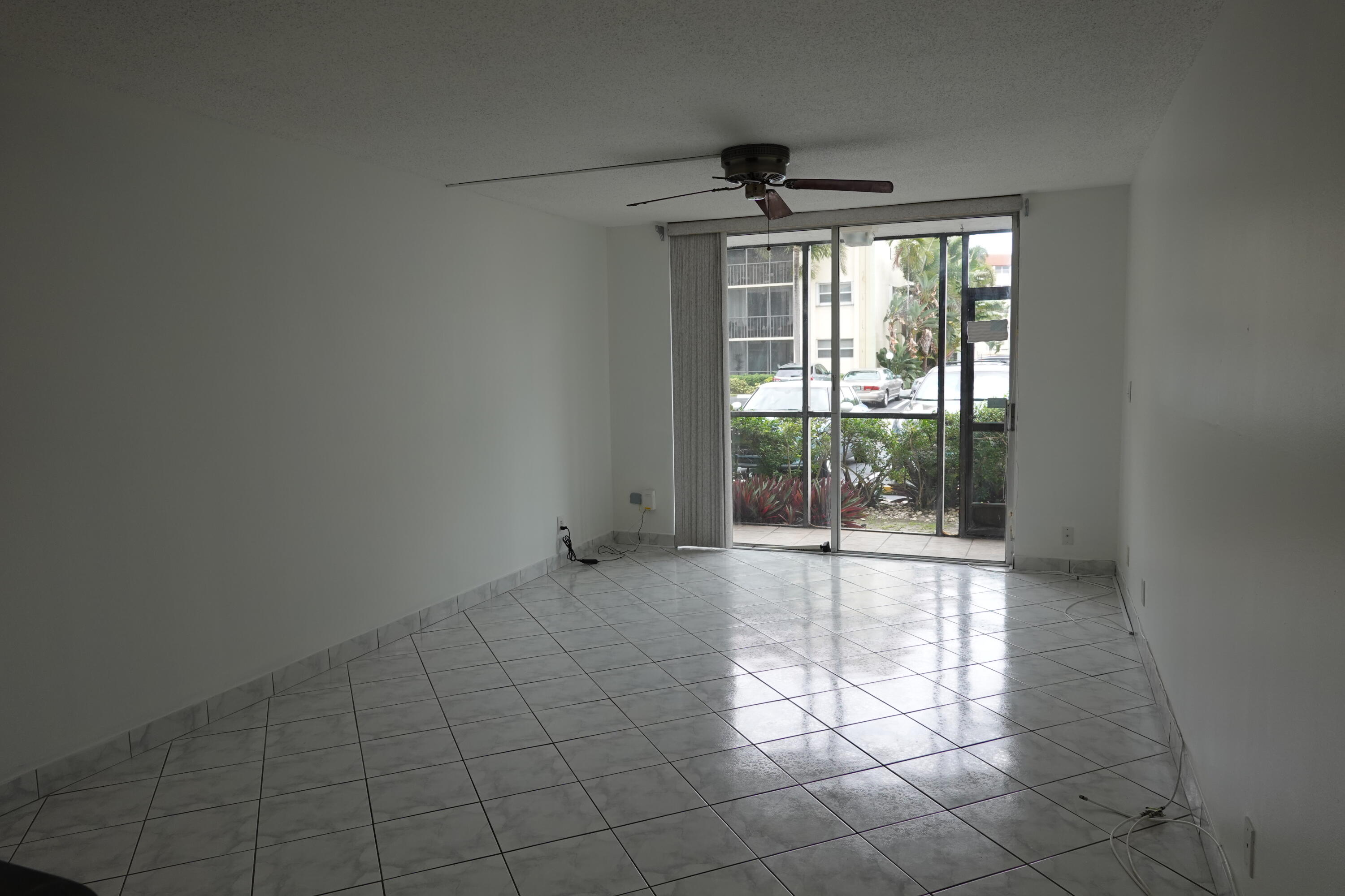 5321 Northeast 24th Terrace, Unit 112A Fort Lauderdale, FL 33308 - Photo 5 of 21 a view of an empty room with a window