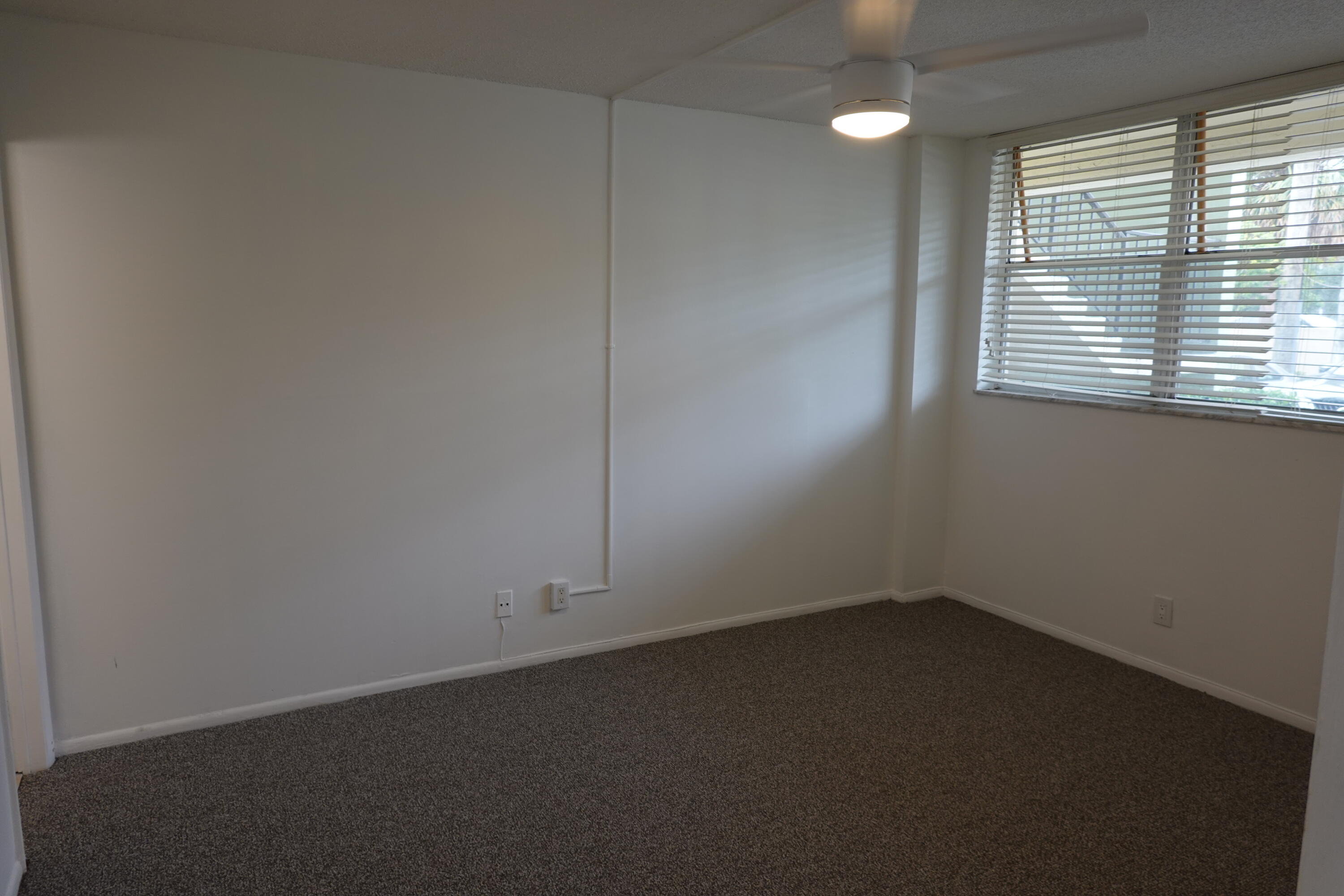 5321 Northeast 24th Terrace, Unit 112A Fort Lauderdale, FL 33308 - Photo 7 of 21 an empty room with a window