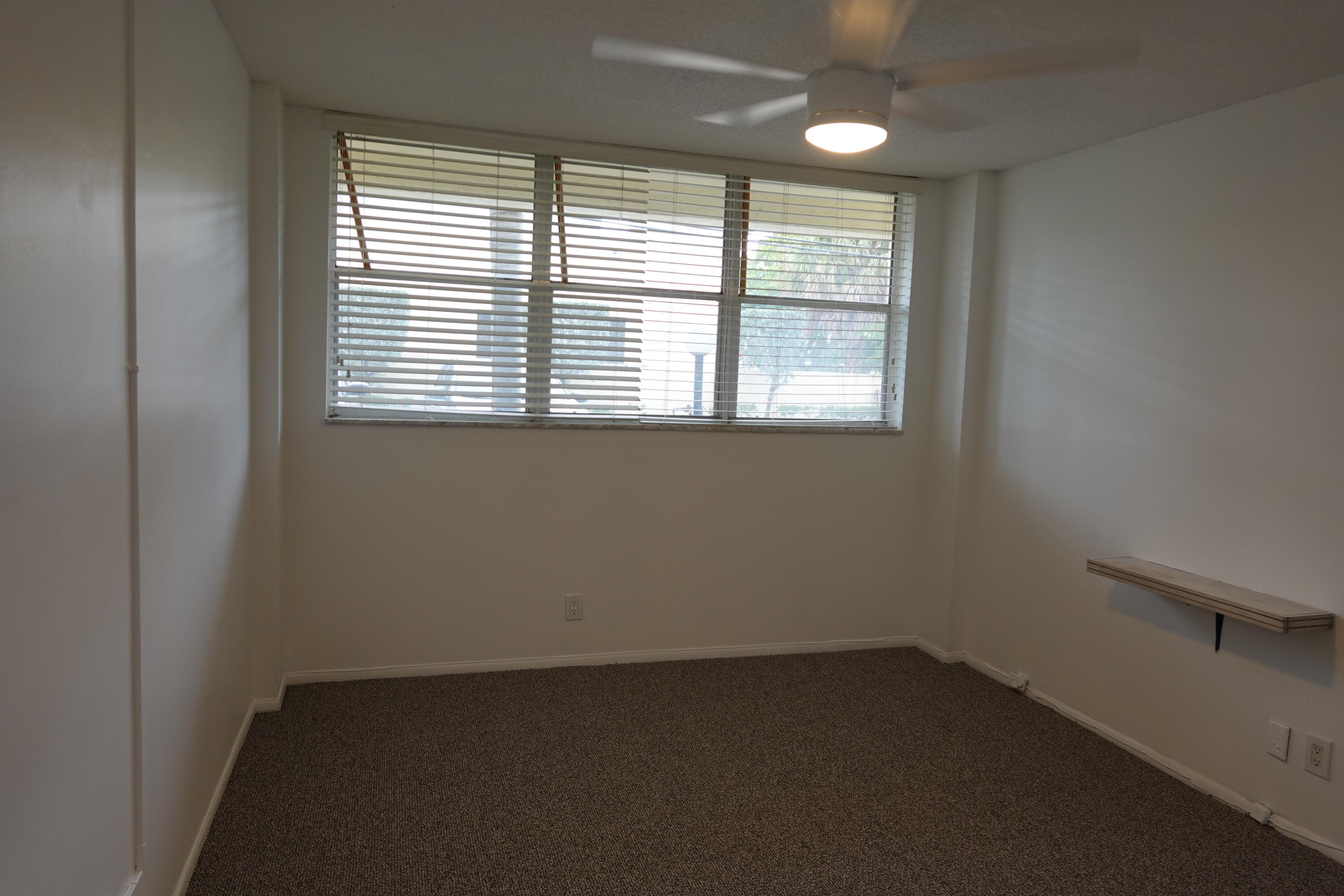 5321 Northeast 24th Terrace, Unit 112A Fort Lauderdale, FL 33308 - Photo 8 of 21 an empty room with a window