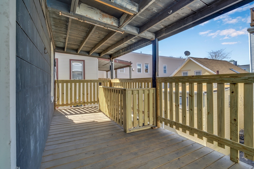 11 Carpenter Street, Unit 3 Boston, MA 02127 - Photo 13 of 22 a view of a porch with wooden floor