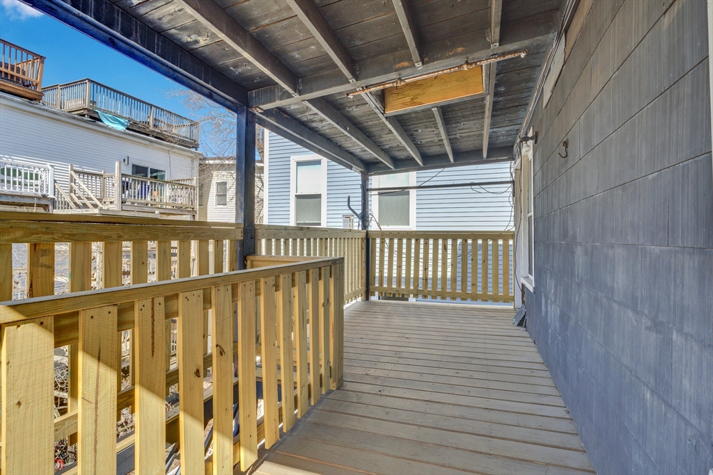 11 Carpenter Street, Unit 3 Boston, MA 02127 - Photo 14 of 22 a view of wooden balcony