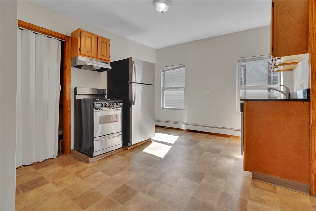 11 Carpenter Street, Unit 3 Boston, MA 02127 - Photo 4 of 22 a view of a kitchen with a sink