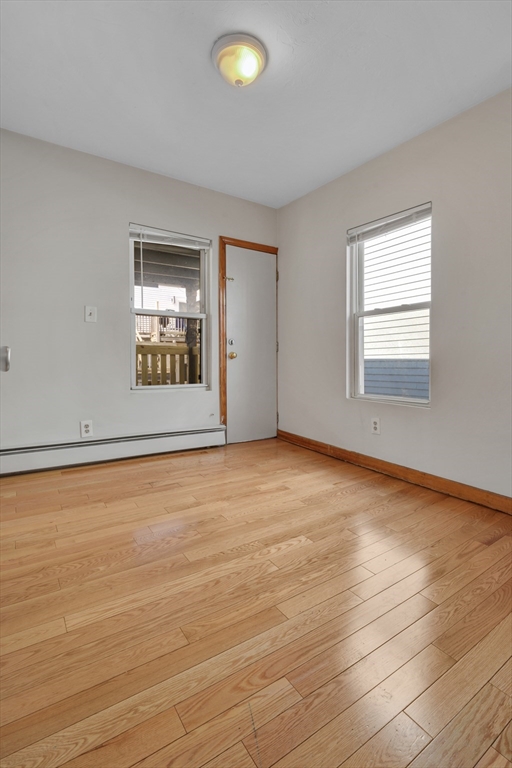 11 Carpenter Street, Unit 3 Boston, MA 02127 - Photo 9 of 22 an empty room with a empty space and windows