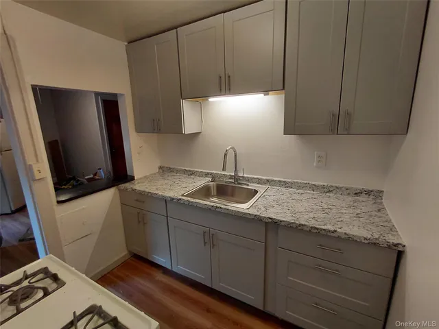 a kitchen with sink cabinets and stove