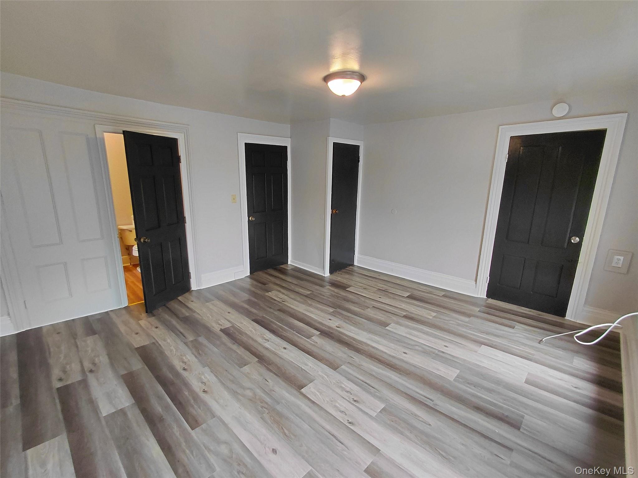 87 West Pierpont Street, Unit 4 Kingston, NY 12401 - Photo 9 of 13 a view of empty room with wooden floor