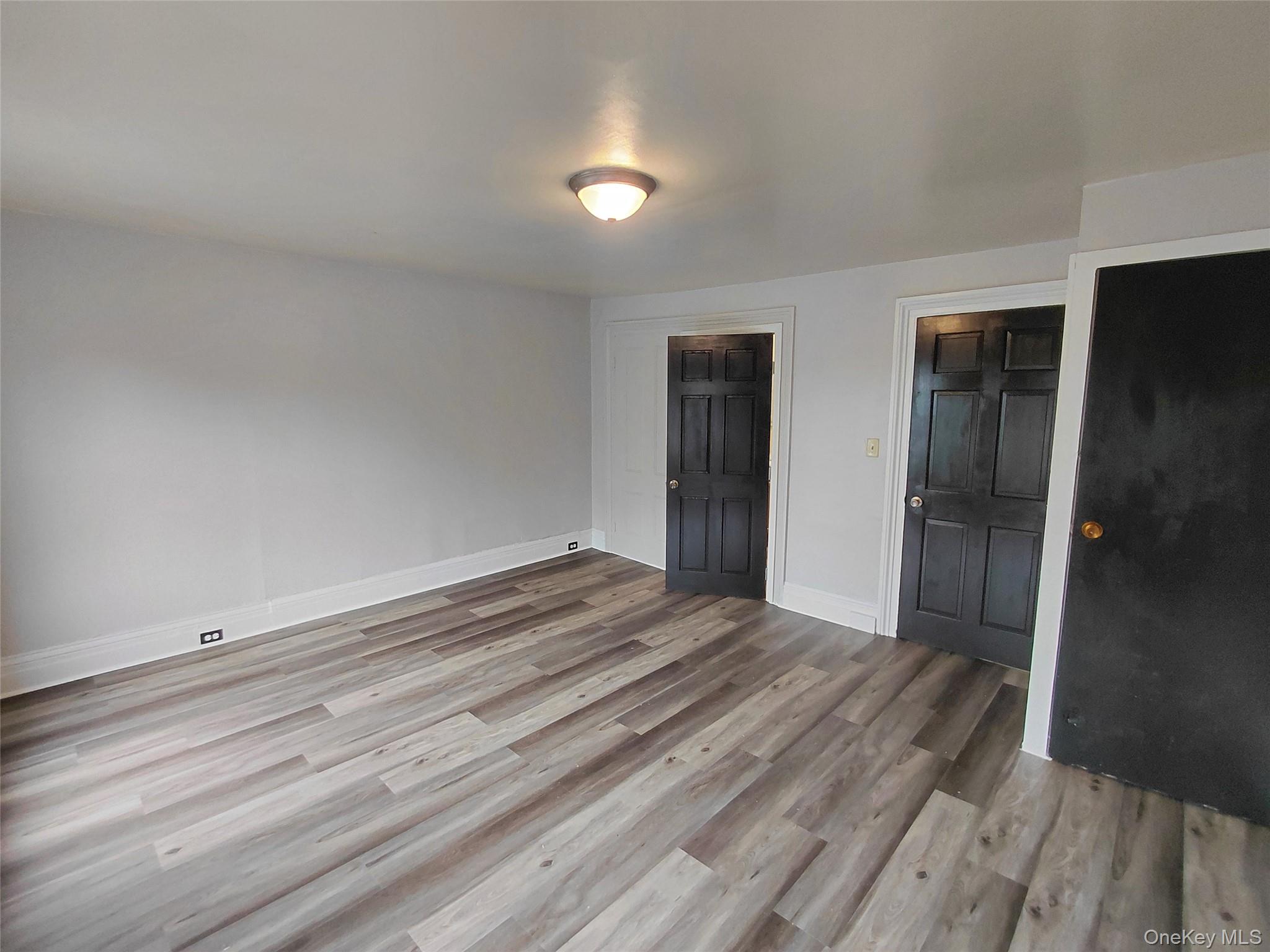 87 West Pierpont Street, Unit 4 Kingston, NY 12401 - Photo 10 of 13 wooden floor in an empty room