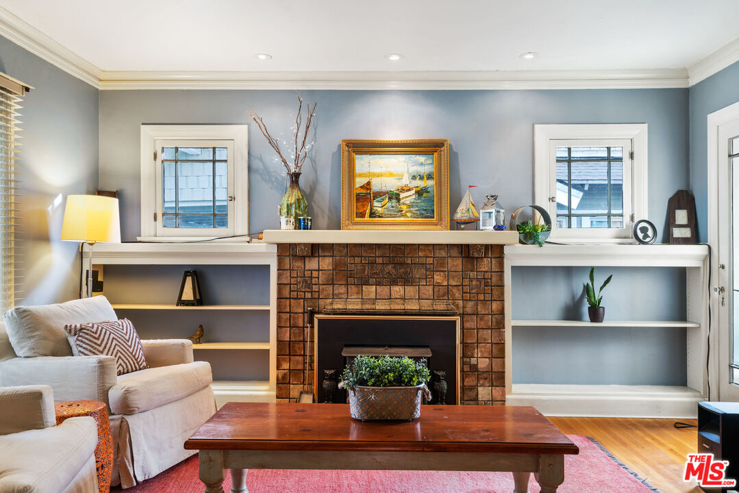 765 Mar Vista Avenue Pasadena, CA 91104 - Photo 11 of 42 a living room with furniture and a fireplace