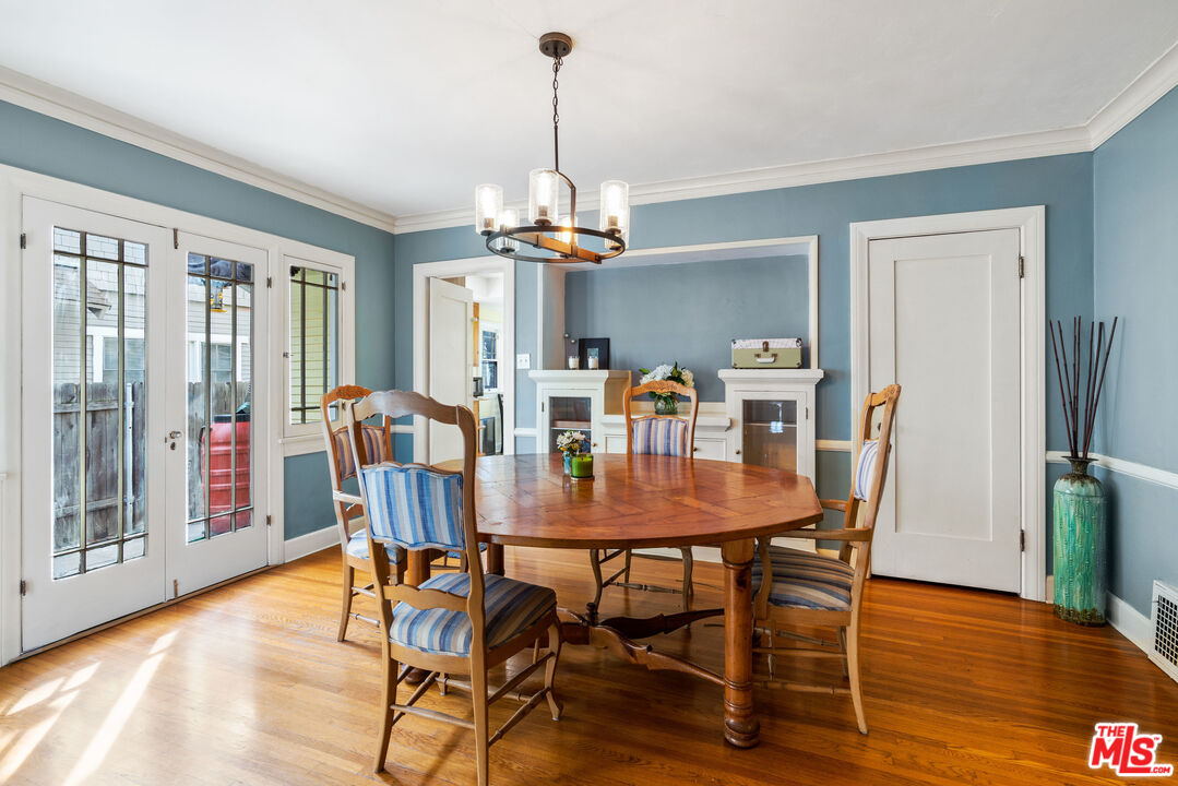 765 Mar Vista Avenue Pasadena, CA 91104 - Photo 12 of 42 a view of a dining room with furniture window and wooden floor