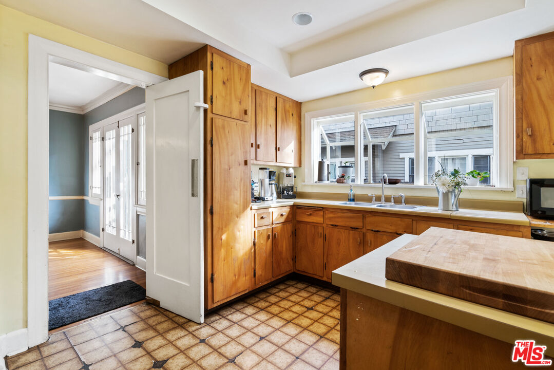 765 Mar Vista Avenue Pasadena, CA 91104 - Photo 16 of 42 a kitchen with stainless steel appliances granite countertop a refrigerator and a sink