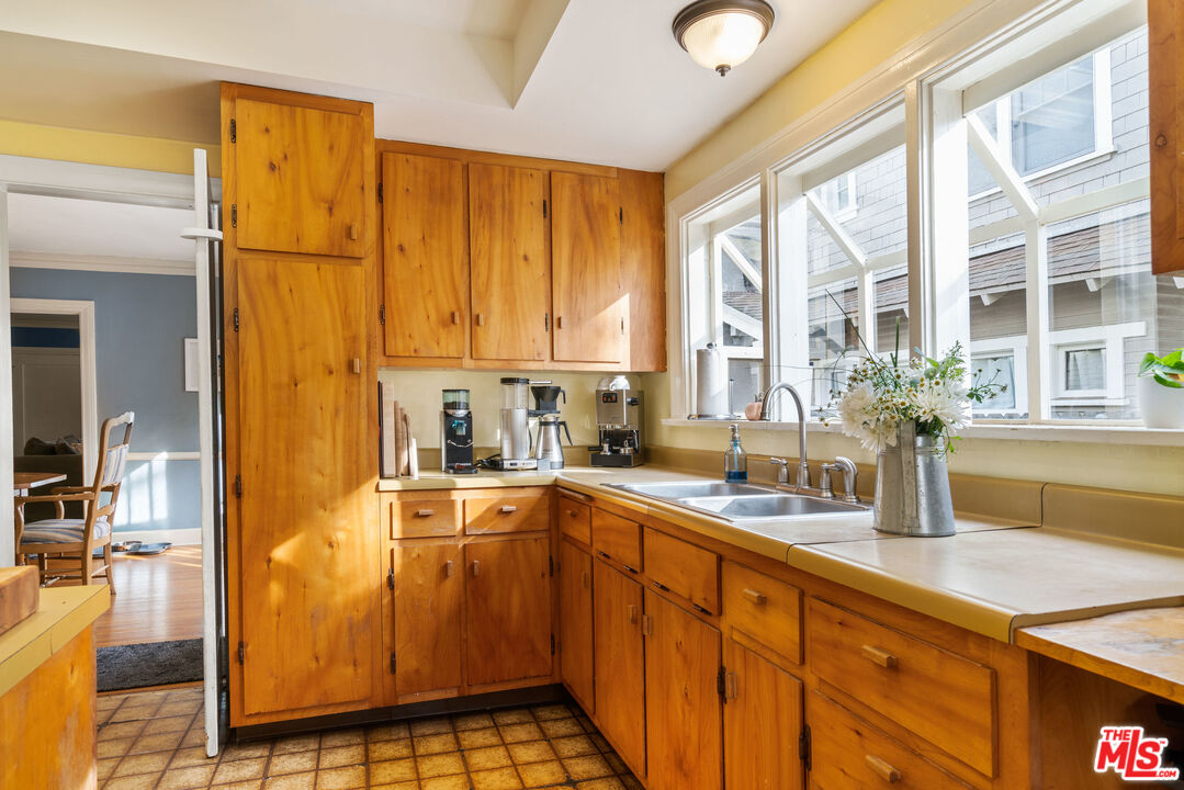 765 Mar Vista Avenue Pasadena, CA 91104 - Photo 19 of 42 a kitchen with a sink and cabinets