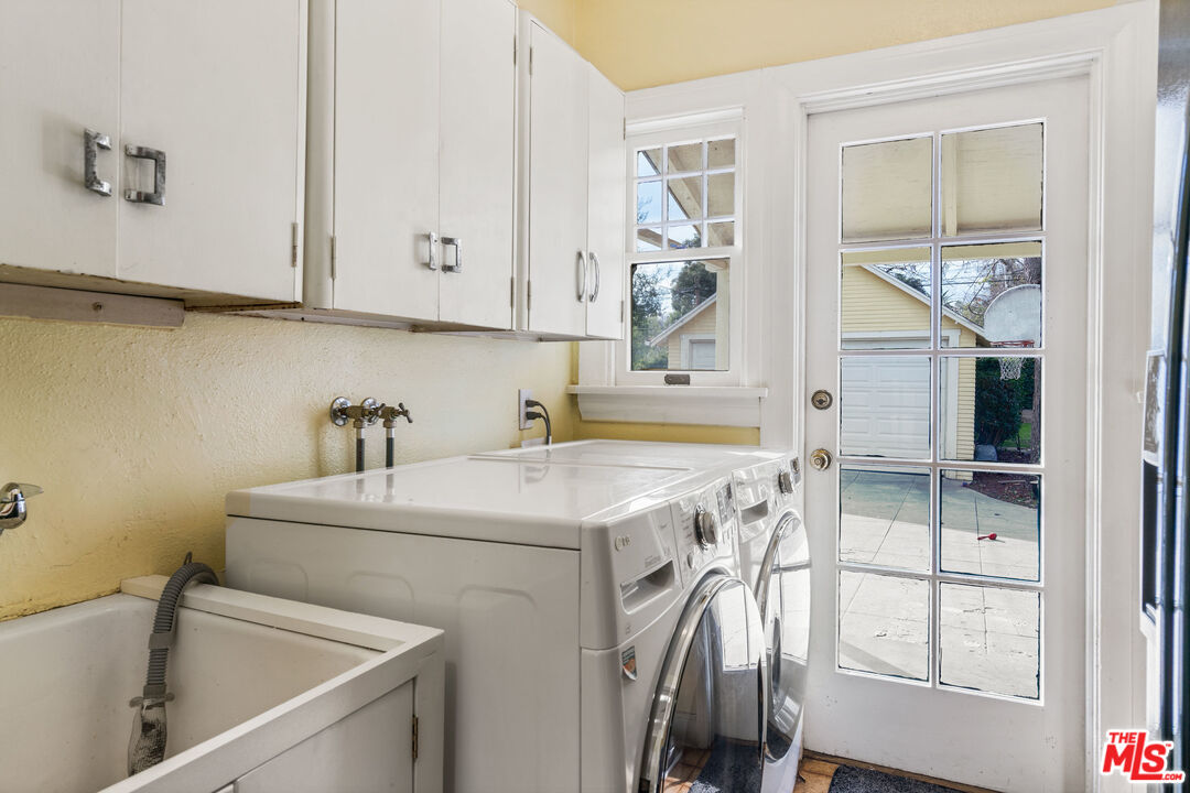 765 Mar Vista Avenue Pasadena, CA 91104 - Photo 22 of 42 a utility room with cabinets washer and dryer