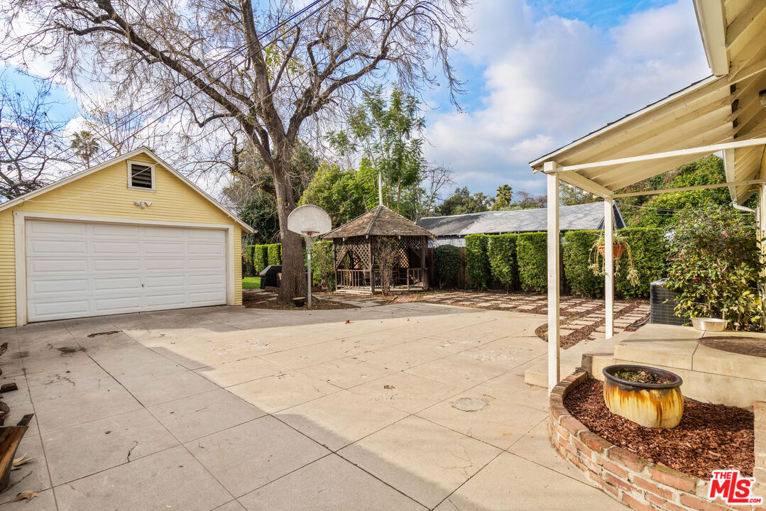 765 Mar Vista Avenue Pasadena, CA 91104 - Photo 25 of 42 a house with trees in front of it