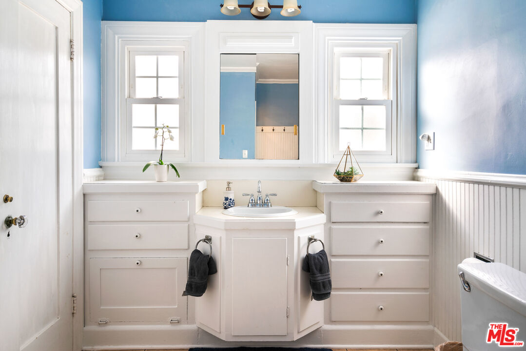 765 Mar Vista Avenue Pasadena, CA 91104 - Photo 38 of 42 a view of vanity a sink a mirror and a window