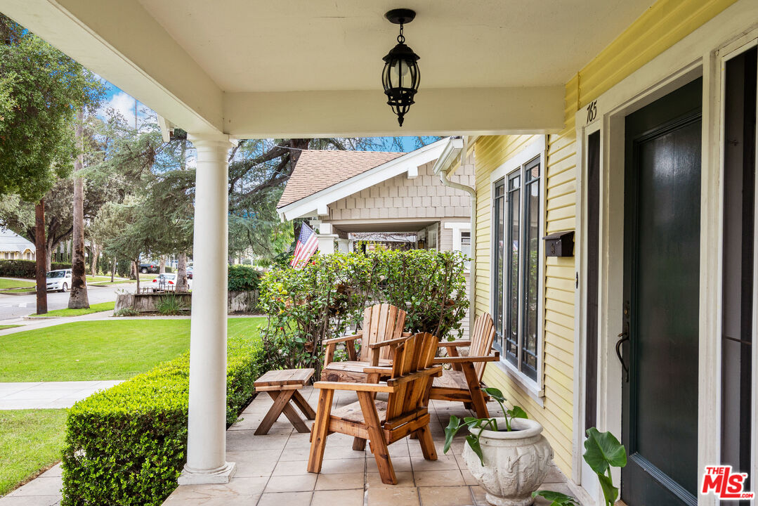 765 Mar Vista Avenue Pasadena, CA 91104 - Photo 5 of 42 a patio with table and chairs and potted plants