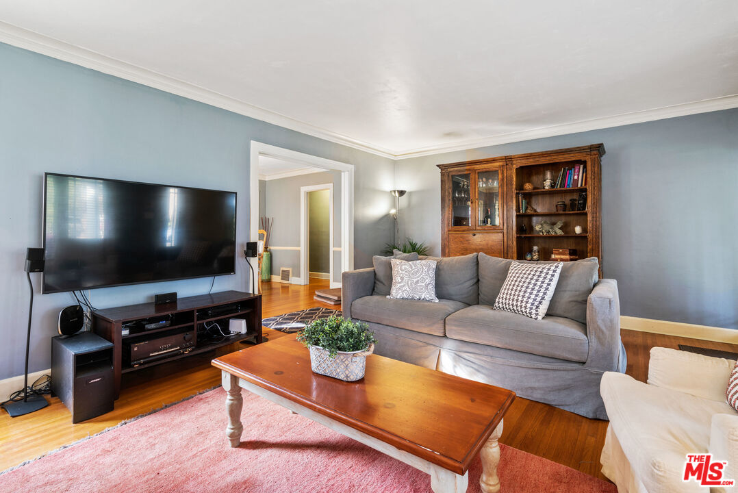 765 Mar Vista Avenue Pasadena, CA 91104 - Photo 10 of 42 a living room with furniture and a flat screen tv