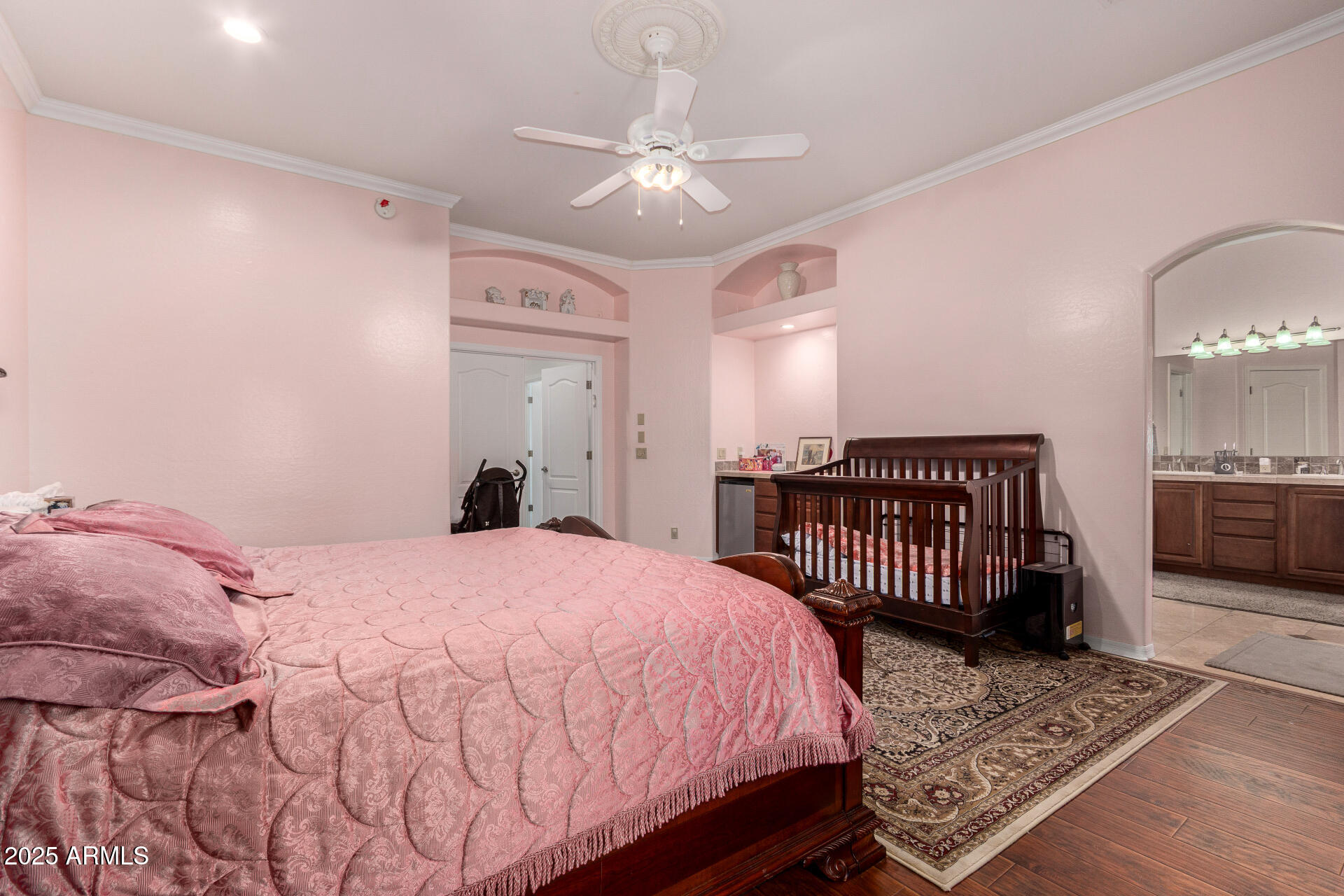 8912 North 15th Lane Phoenix, AZ 85021 - Photo 17 of 33 a bed room with a bed and a chandelier